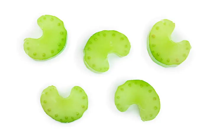 thin slices of celery on a white background